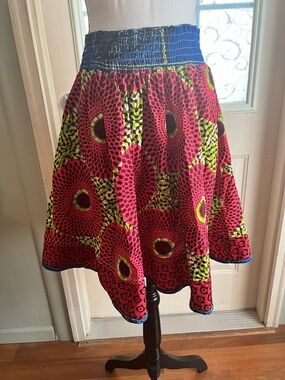 The Sankofa Center fair trade African inspired shirred waist tribal print skirt.